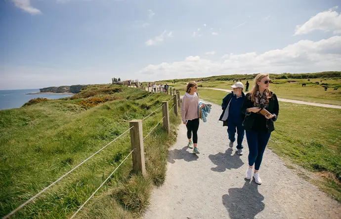 Student group walking along Normandy beaches